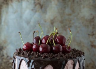 Birthday Cake : A 3 layer white cake filled with chopped cherries and cherry buttercream. Topped…