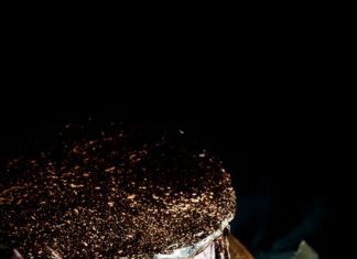 Birthday Decoration Ideas : Make an Oreo olallieberry chocolate layer cake with gold flake toppping.