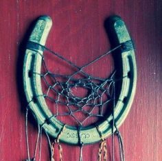 Birthday Gifts Inspiration : Dream catcher made out of horse shoe with pebbles, beads and feathers.